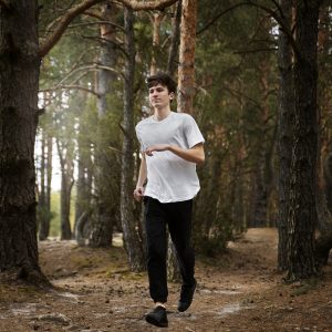 full shot man running nature